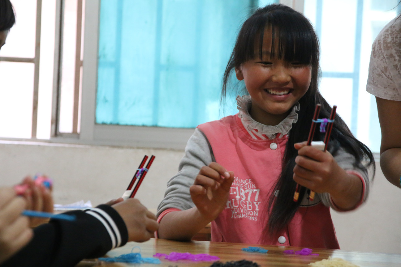 Bracelet-Making at an orphanage. She was so happy to see the loom band coming together.